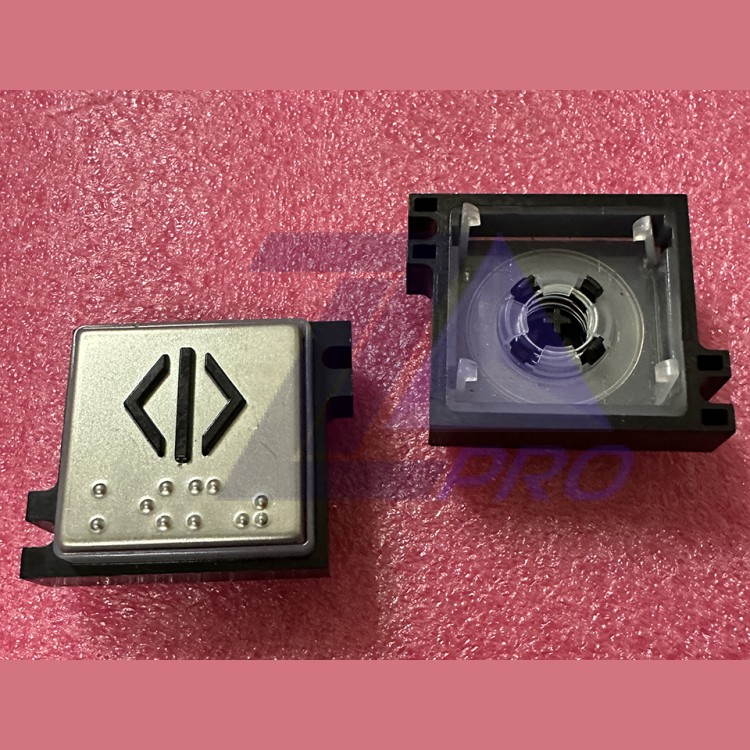 Толкатель кнопки с выдавленной надписью "<I>" шрифт Брайля Schindler